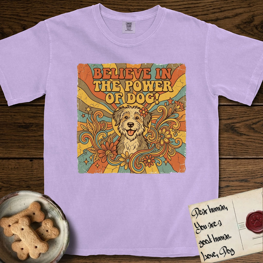 Believe in the Power of Dog Rescue Mutt T-Shirt flat lay in Orchid, featuring a retro 1970s groovy poster of a grinning rescue mutt with a radiating sunburst and swirling florals.