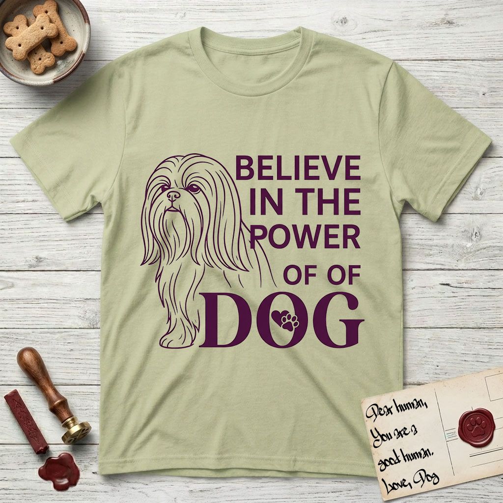 Believe in the Power of Dog Shih Tzu Line Drawing T-Shirt flat lay in Pistachio, featuring a clean single-color line drawing of a long-coated Shih Tzu beside the stacked words Believe in the Power of Dog with a paw print pressed into the O.
