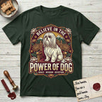 Believe in the Power of Dog Shih Tzu Throne T-Shirt flat lay in Forest Green, featuring an ornate dark badge with a Shih Tzu seated on a throne among chrysanthemums, lotus blossoms and mountain landscapes, and the words Grace, Wisdom, Devotion.