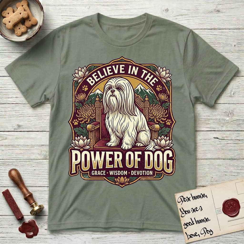 Believe in the Power of Dog Shih Tzu Throne T-Shirt flat lay in Sage, featuring an ornate dark badge with a Shih Tzu seated on a throne among chrysanthemums, lotus blossoms and mountain landscapes, and the words Grace, Wisdom, Devotion.