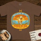 Believe in the Power of Dog Yellow Lab T-Shirt flat lay in Espresso, featuring a vintage oval badge with a haloed Yellow Lab running through a field of wildflowers and the words Joy, Loyalty, Love.
