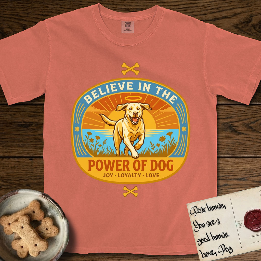 Believe in the Power of Dog Yellow Lab T-Shirt flat lay in Terracotta, featuring a vintage oval badge with a haloed Yellow Lab running through a field of wildflowers and the words Joy, Loyalty, Love.