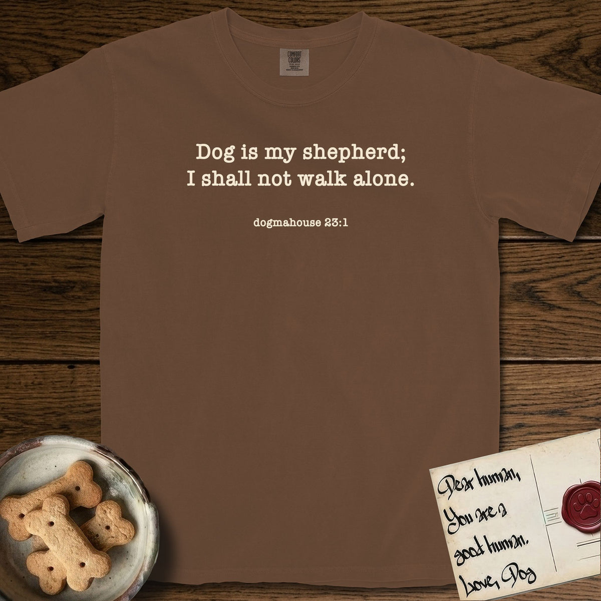 Dog is My Shepherd T-Shirt flat lay in Espresso, featuring Small centered typewriter-type text reading Dog is my shepherd; I shall not walk alone, with the citation dogmahouse 23:1 beneath it.