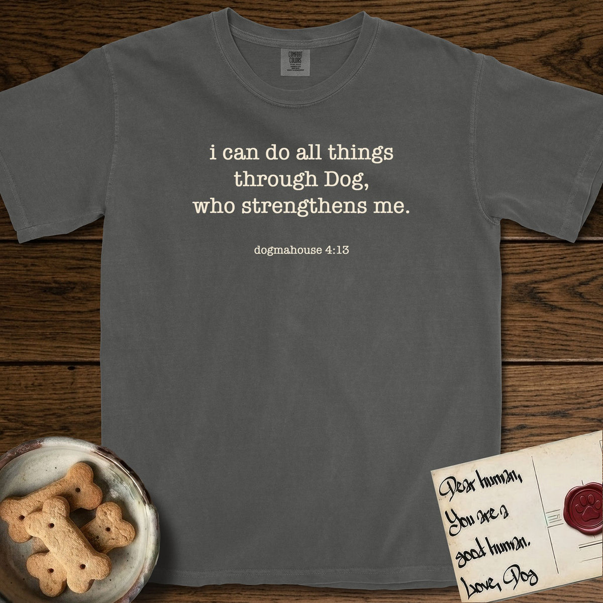 I Can Do All Things T-Shirt flat lay in Pepper, featuring Small centered typewriter-type text reading i can do all things through Dog, who strengthens me, with the citation dogmahouse 4:13 beneath it.