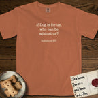 If Dog is For Us T-Shirt flat lay in Yam, featuring Small centered typewriter-type text reading if Dog is for us, who can be against us?, with the citation dogmahouse 8:31 beneath it.