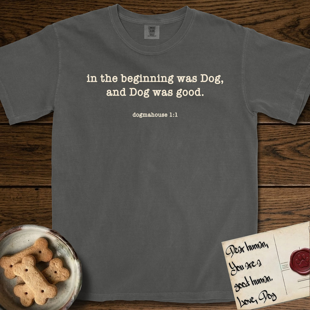 In the Beginning T-Shirt flat lay in Pepper, featuring Small centered typewriter-type text reading in the beginning was Dog, and Dog was good, with the citation dogmahouse 1:1 beneath it.