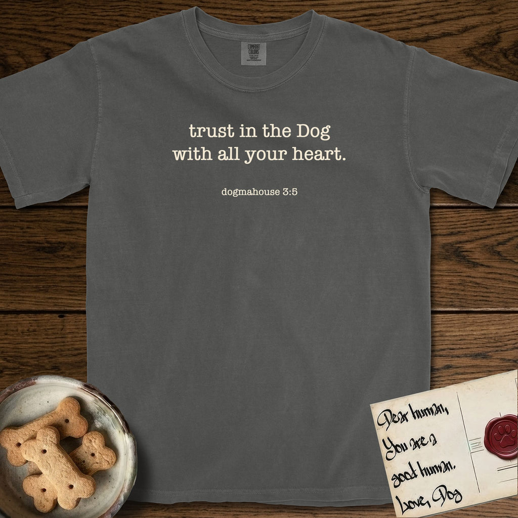 Trust in the Dog T-Shirt flat lay in Pepper, featuring Small centered typewriter-type text reading trust in the Dog with all your heart, with the citation dogmahouse 3:5 beneath it.