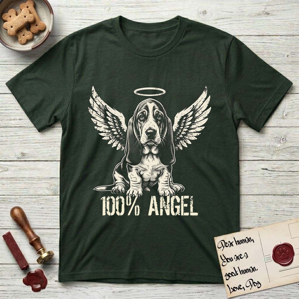 Basset Hound T-Shirt flat lay in Forest Green, featuring Distressed cream one-color screen-print of a Basset Hound puppy as an angel, long ears draping forward, wings spread and a halo above, with 100% ANGEL lettering across the bottom.