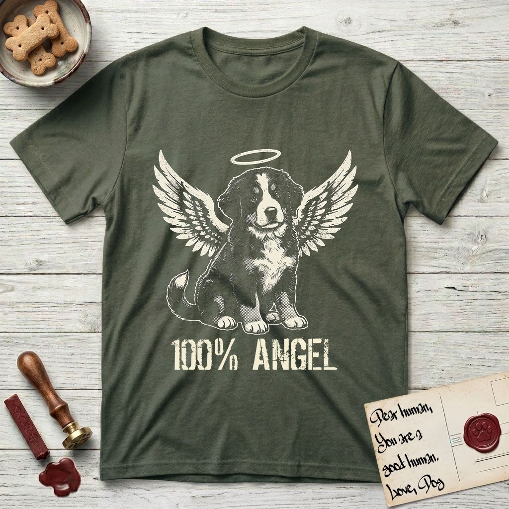 Bernese Mountain Dog T-Shirt flat lay in Heather Military Green, featuring Distressed cream one-color screen-print of a Bernese Mountain Dog puppy as an angel, three-quarter sitting pose with bushy tail curled, wings spread and a halo above, with 100% ANGEL lettering across the bottom.