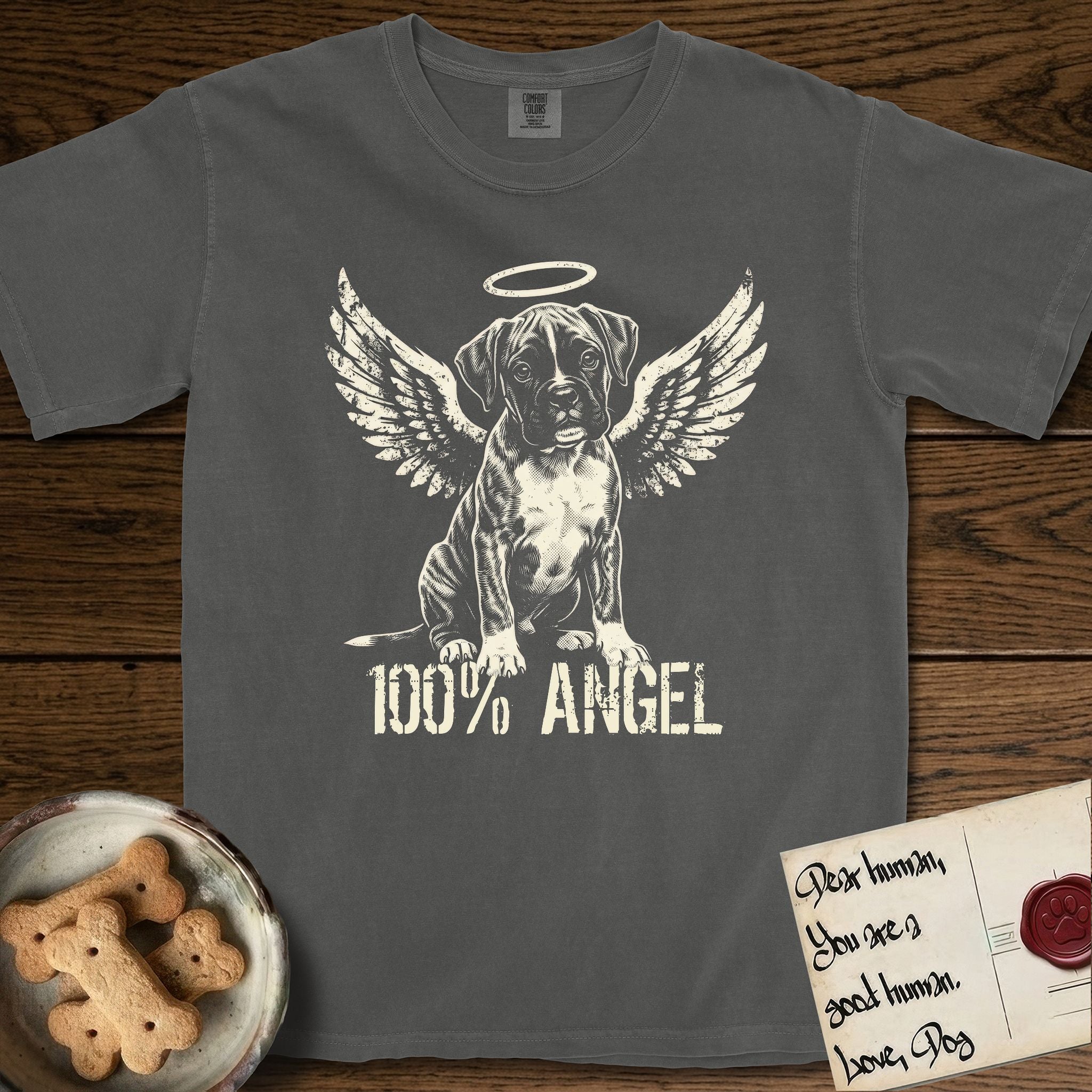 Boxer T-Shirt flat lay in Pepper, featuring Distressed cream one-color screen-print of a Boxer puppy as an angel, wrinkly face with a slight head tilt, wings spread and a halo above, with 100% ANGEL lettering across the bottom.