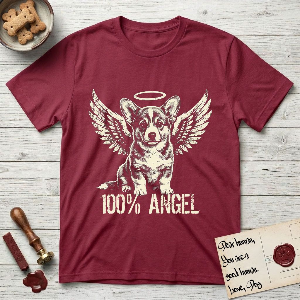 Corgi T-Shirt flat lay in Cardinal Red, featuring Distressed cream one-color screen-print of a Pembroke Welsh Corgi puppy as an angel, big erect ears and short legs, wings spread and a halo above, with 100% ANGEL lettering across the bottom.
