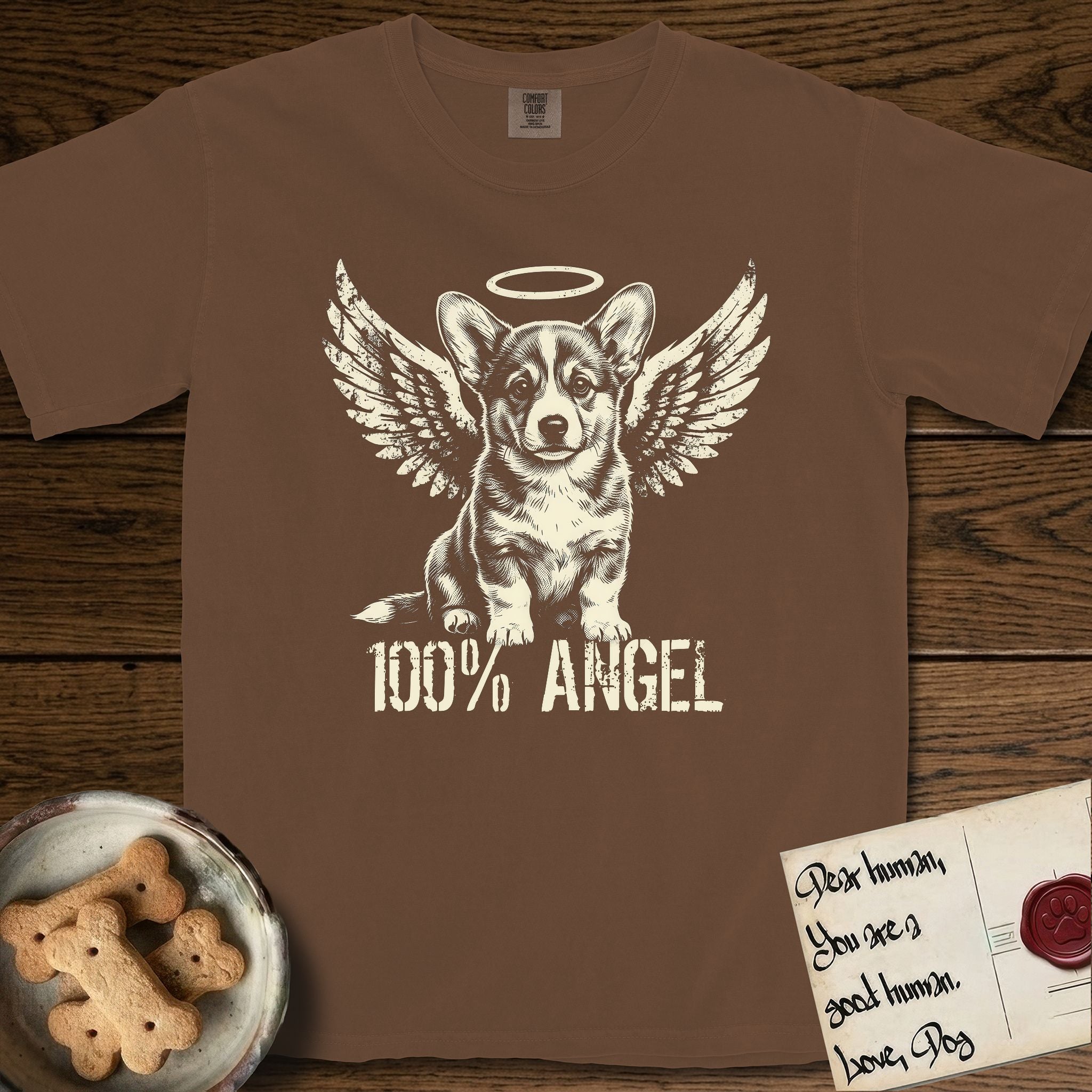 Corgi T-Shirt flat lay in Espresso, featuring Distressed cream one-color screen-print of a Pembroke Welsh Corgi puppy as an angel, big erect ears and short legs, wings spread and a halo above, with 100% ANGEL lettering across the bottom.