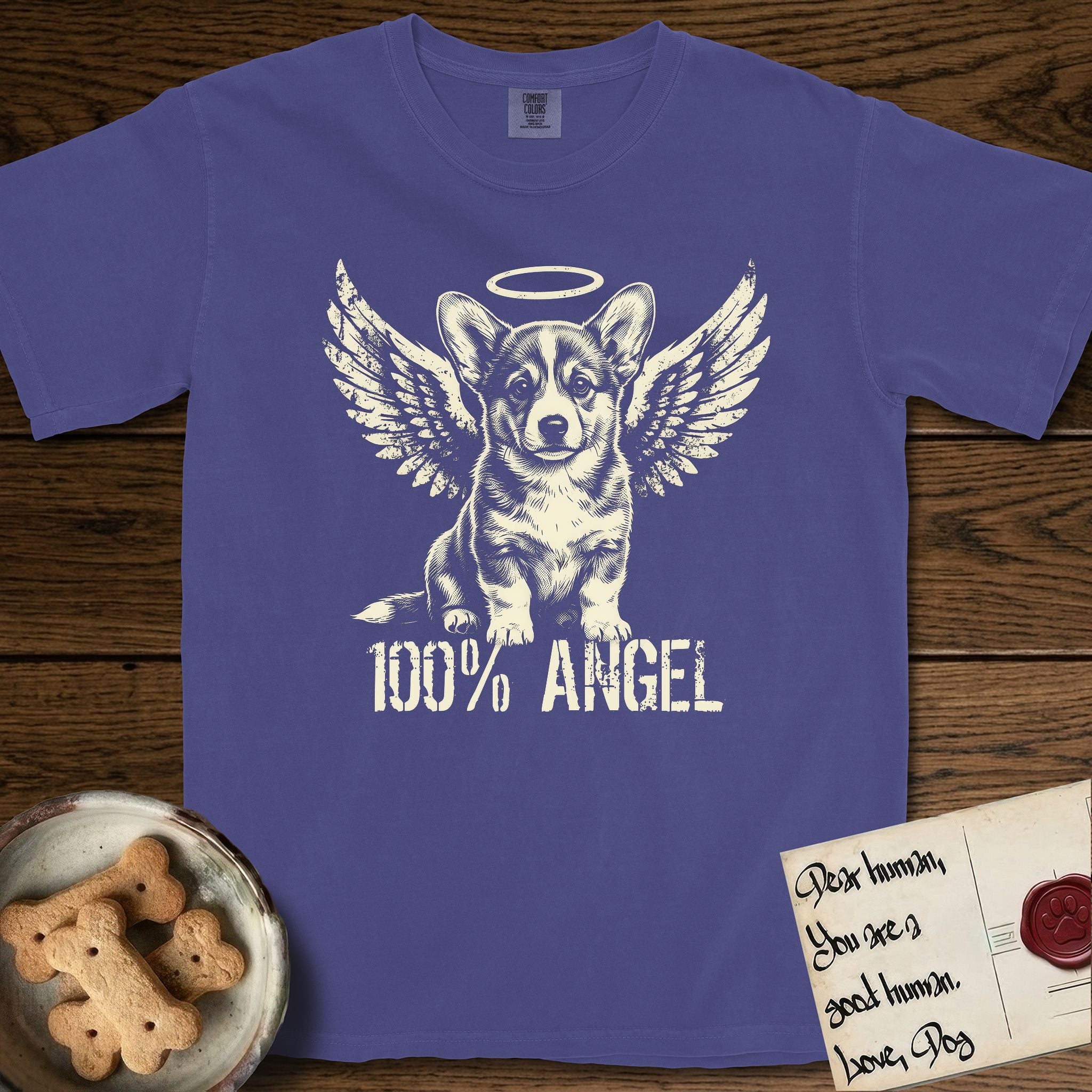 Corgi T-Shirt flat lay in Grape, featuring Distressed cream one-color screen-print of a Pembroke Welsh Corgi puppy as an angel, big erect ears and short legs, wings spread and a halo above, with 100% ANGEL lettering across the bottom.
