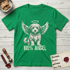 Coton de Tulear T-Shirt flat lay in Irish Green, featuring Distressed cream one-color screen-print of a fluffy white Coton de Tulear puppy as an angel, plumed tail curled beside him, wings spread and a halo above, with 100% ANGEL lettering across the bottom.