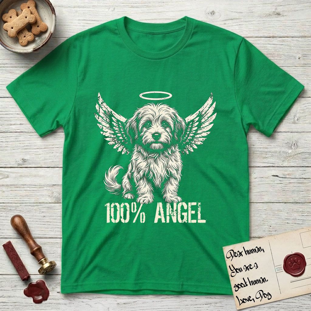 Coton de Tulear T-Shirt flat lay in Irish Green, featuring Distressed cream one-color screen-print of a fluffy white Coton de Tulear puppy as an angel, plumed tail curled beside him, wings spread and a halo above, with 100% ANGEL lettering across the bottom.