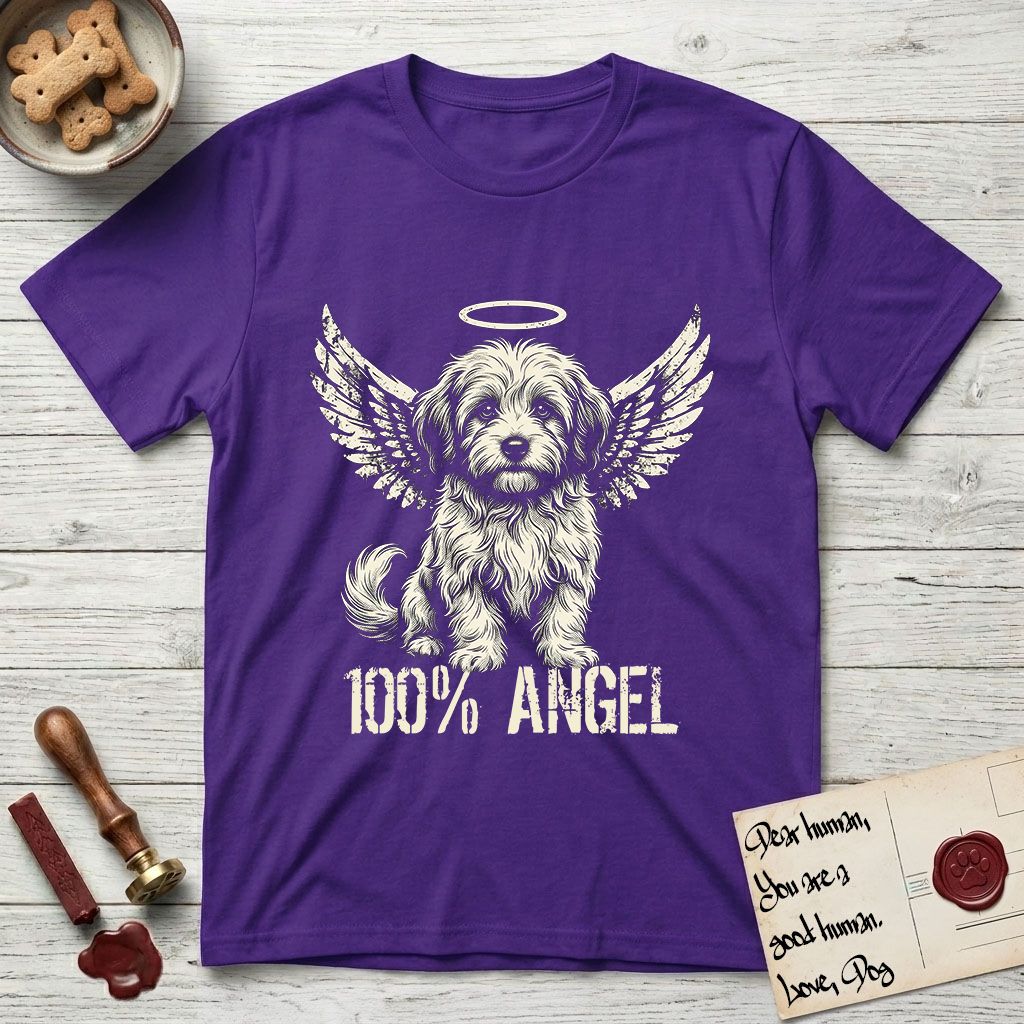 Coton de Tulear T-Shirt flat lay in Purple, featuring Distressed cream one-color screen-print of a fluffy white Coton de Tulear puppy as an angel, plumed tail curled beside him, wings spread and a halo above, with 100% ANGEL lettering across the bottom.