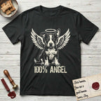 Lobo T-Shirt flat lay in Black, featuring Distressed cream one-color screen-print of a black-and-white Australian Cattle Dog and Pitbull mix puppy as an angel, big upright ears with one tip folded, wings spread and a halo above, with 100% ANGEL lettering across the bottom.