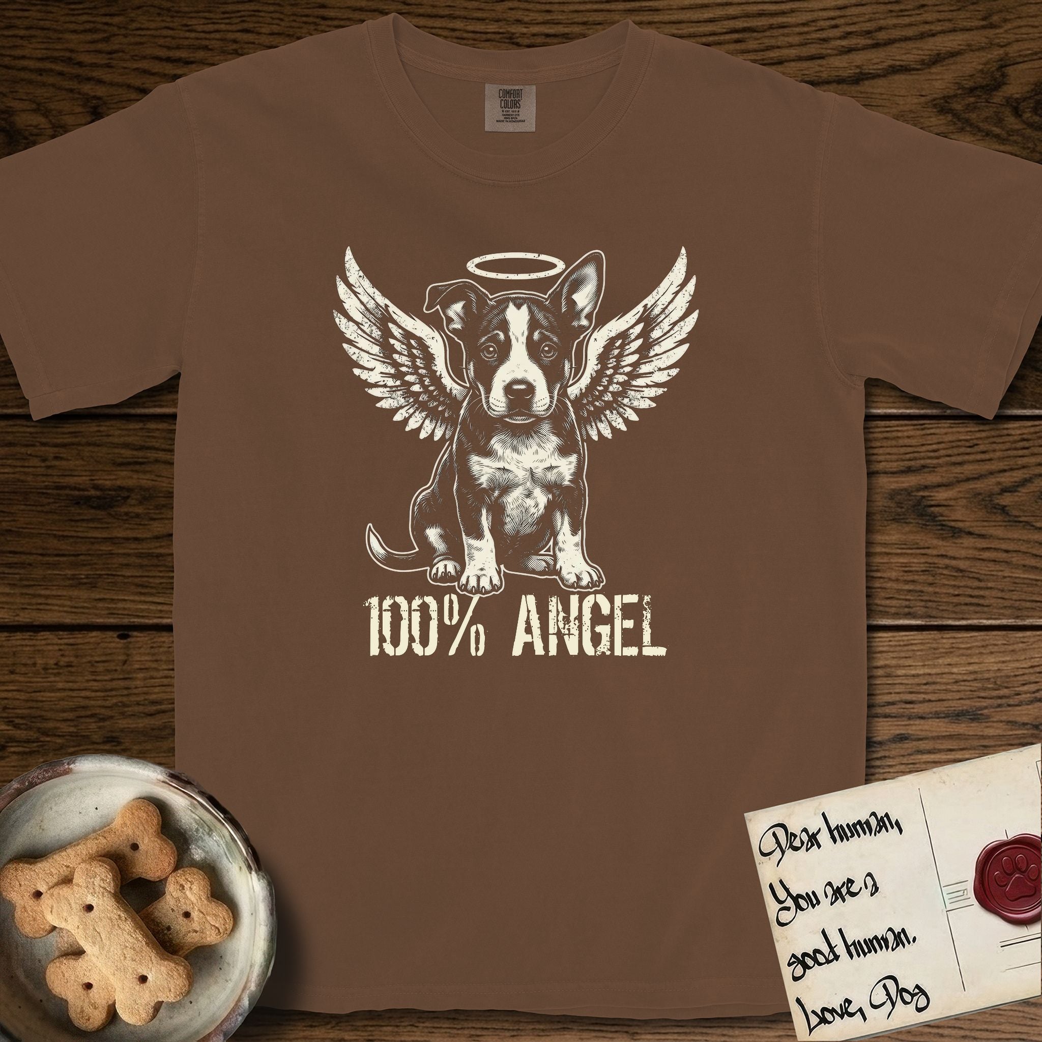 Lobo T-Shirt flat lay in Espresso, featuring Distressed cream one-color screen-print of a black-and-white Australian Cattle Dog and Pitbull mix puppy as an angel, big upright ears with one tip folded, wings spread and a halo above, with 100% ANGEL lettering across the bottom.