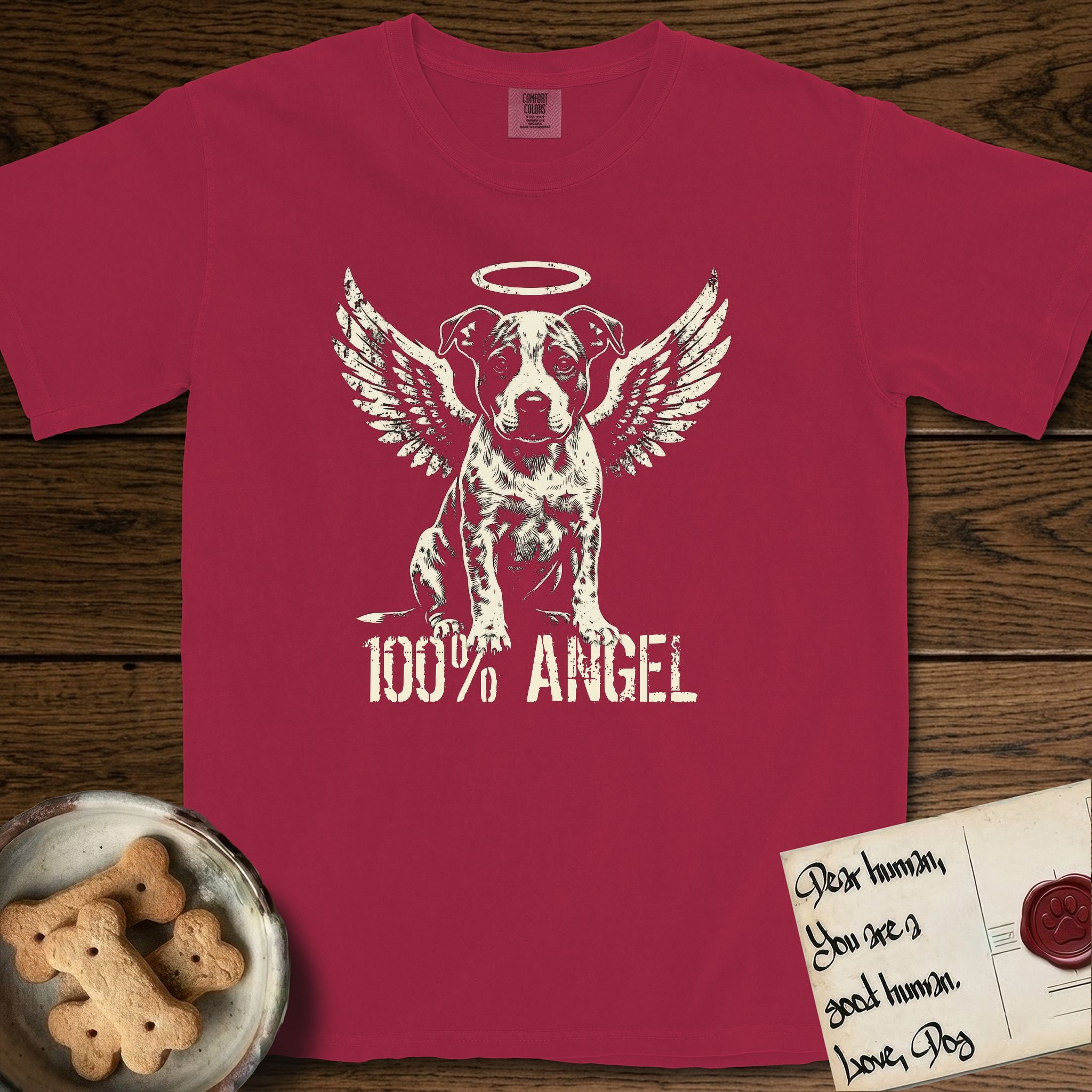 Pitbull T-Shirt flat lay in Chili, featuring Distressed cream one-color screen-print of a Pitbull puppy as an angel, feathered wings spread and a halo above, sitting front-on, with 100% ANGEL lettering across the bottom.