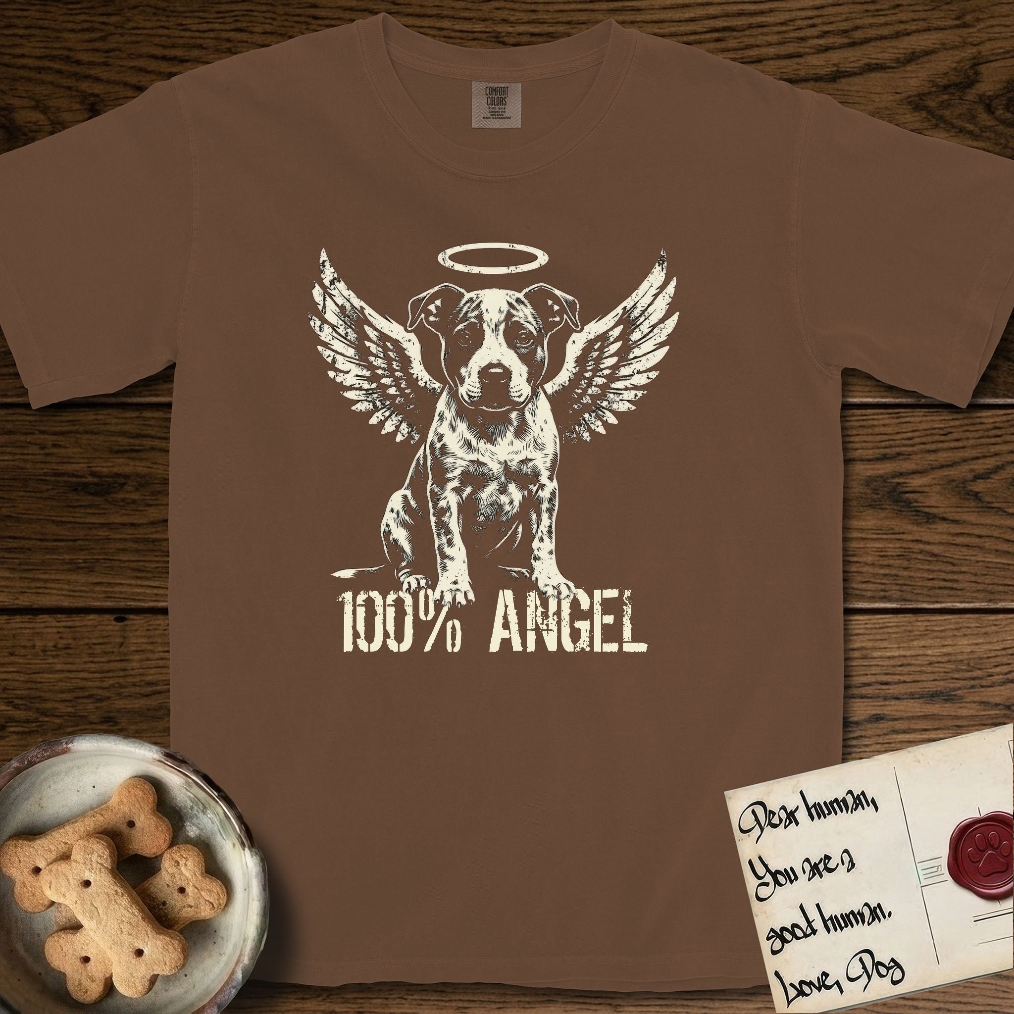 Pitbull T-Shirt flat lay in Espresso, featuring Distressed cream one-color screen-print of a Pitbull puppy as an angel, feathered wings spread and a halo above, sitting front-on, with 100% ANGEL lettering across the bottom.