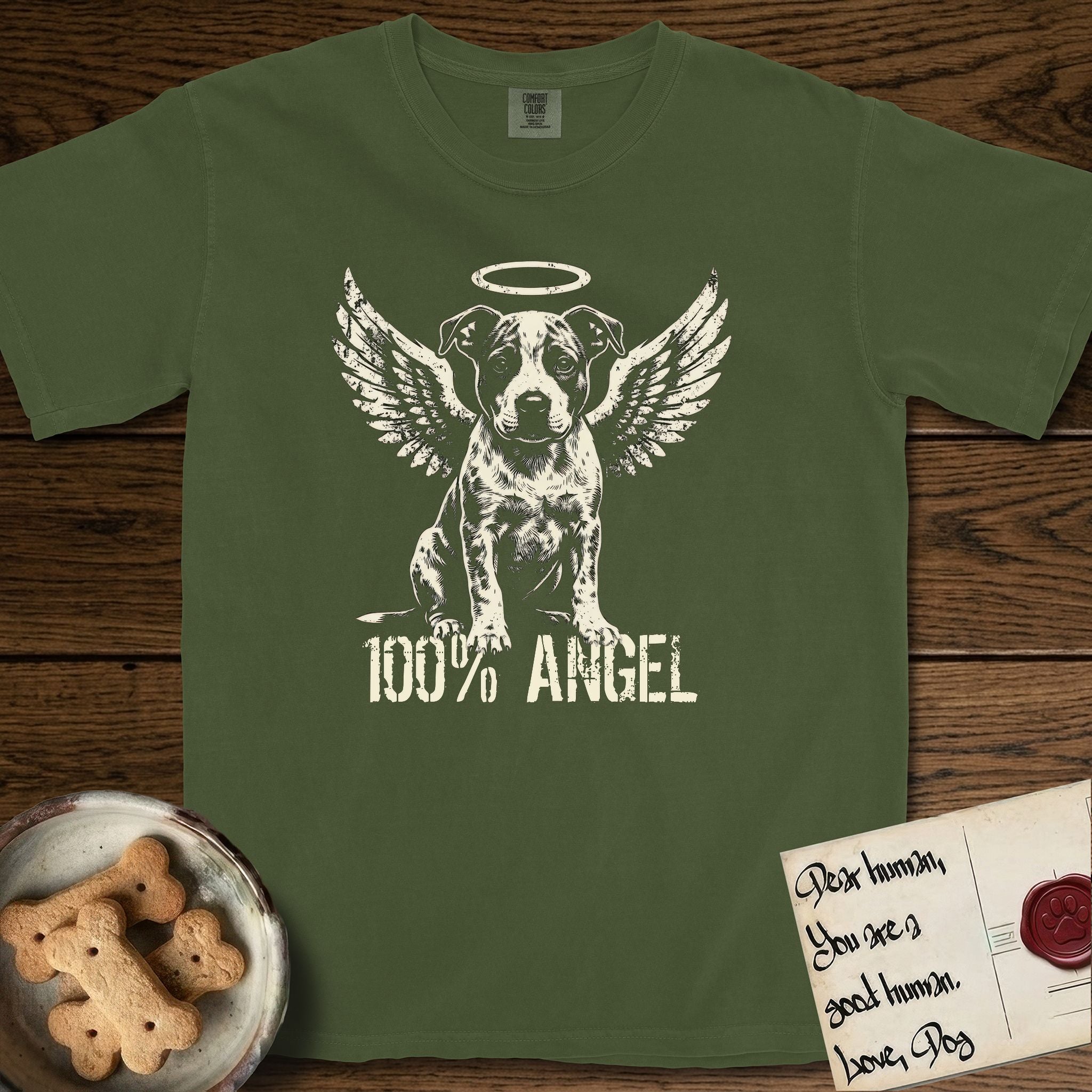 Pitbull T-Shirt flat lay in Hemp, featuring Distressed cream one-color screen-print of a Pitbull puppy as an angel, feathered wings spread and a halo above, sitting front-on, with 100% ANGEL lettering across the bottom.