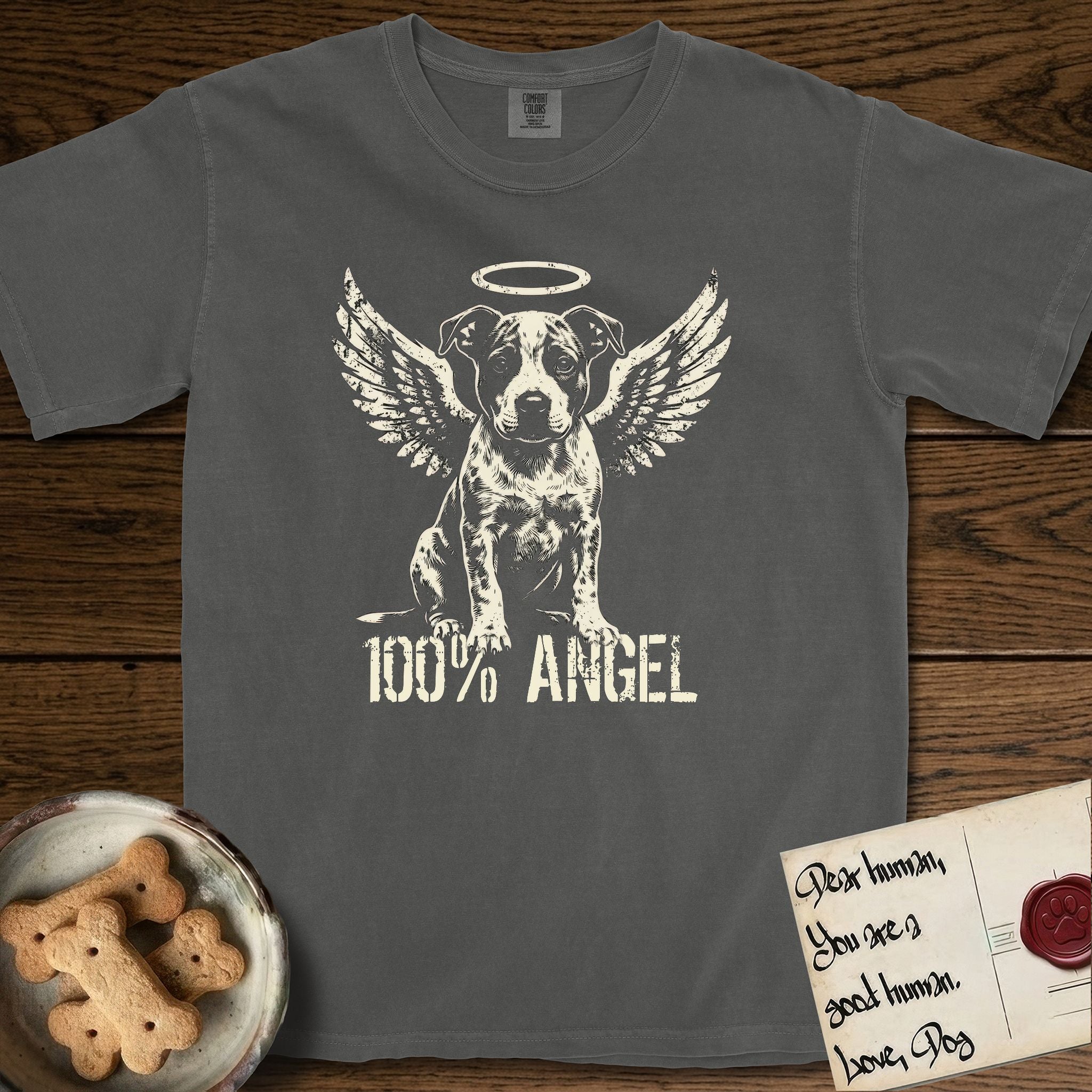 Pitbull T-Shirt flat lay in Pepper, featuring Distressed cream one-color screen-print of a Pitbull puppy as an angel, feathered wings spread and a halo above, sitting front-on, with 100% ANGEL lettering across the bottom.
