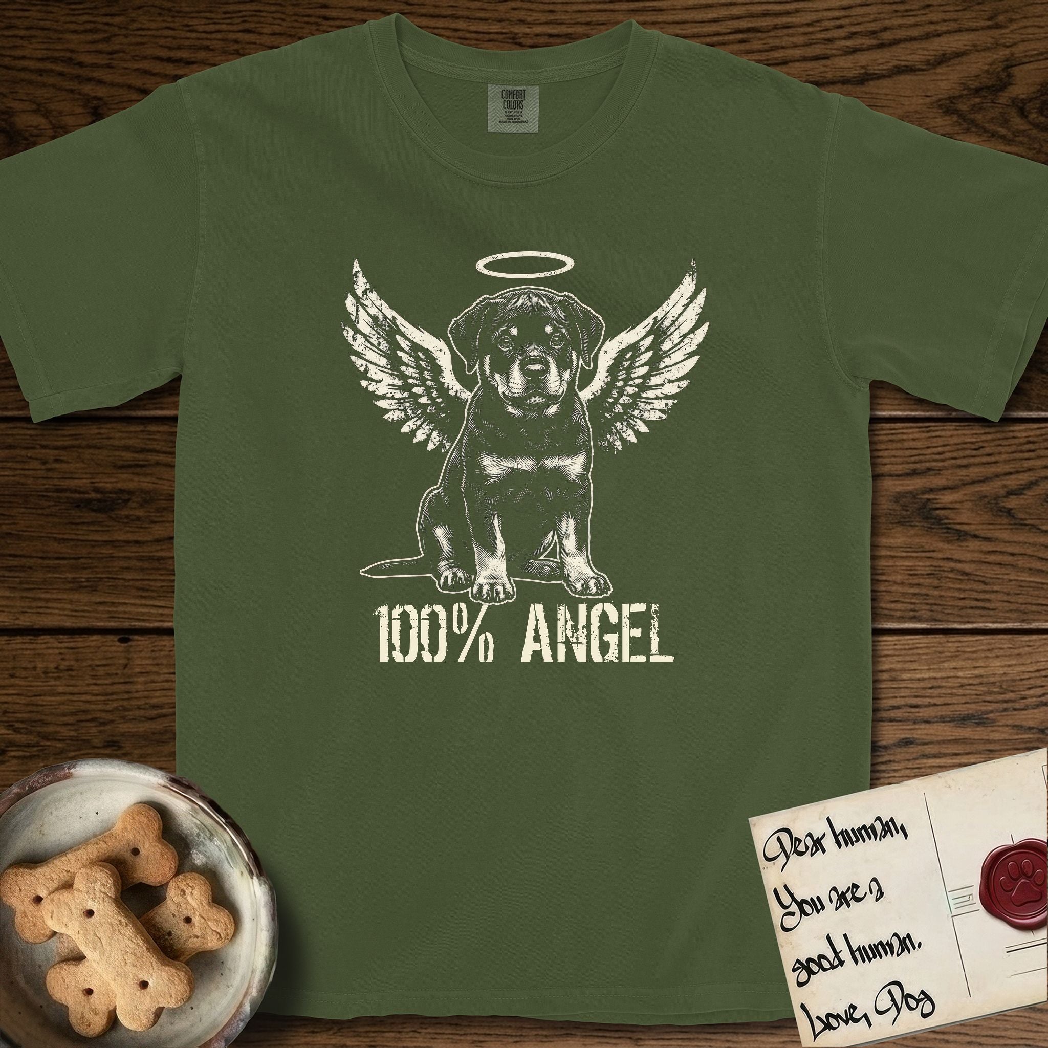 Rottweiler T-Shirt flat lay in Hemp, featuring Distressed cream one-color screen-print of a Rottweiler puppy as an angel, sitting square and sturdy, wings spread and a halo above, with 100% ANGEL lettering across the bottom.