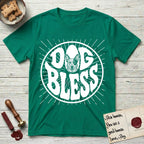 Dog Bless Australian Cattle Dog T-Shirt flat lay in Kelly Green, featuring Retro bubble-letter badge reading DOG BLESS with a speckled Australian Cattle Dog face framed in the letter O, hand-drawn sunburst rays radiating outward.