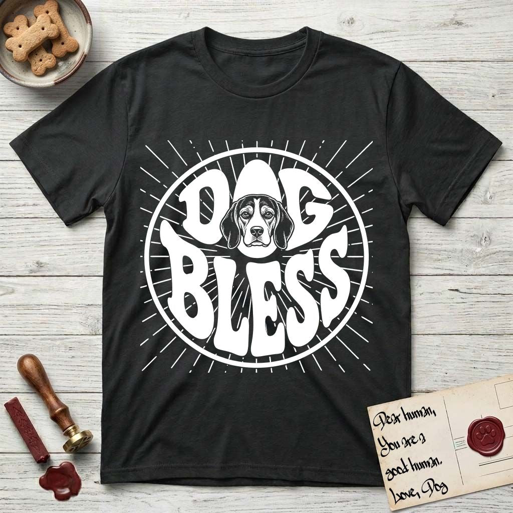 Dog Bless Beagle T-Shirt flat lay in Black, featuring Retro bubble-letter badge reading DOG BLESS with a gentle Beagle face framed in the letter O, hand-drawn sunburst rays radiating outward.
