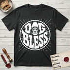 Dog Bless Beagle T-Shirt flat lay in Black, featuring Retro bubble-letter badge reading DOG BLESS with a gentle Beagle face framed in the letter O, hand-drawn sunburst rays radiating outward.