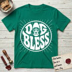 Dog Bless Beagle T-Shirt flat lay in Kelly Green, featuring Retro bubble-letter badge reading DOG BLESS with a gentle Beagle face framed in the letter O, hand-drawn sunburst rays radiating outward.