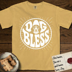 Dog Bless Beagle T-Shirt flat lay in Mustard, featuring Retro bubble-letter badge reading DOG BLESS with a gentle Beagle face framed in the letter O, hand-drawn sunburst rays radiating outward.