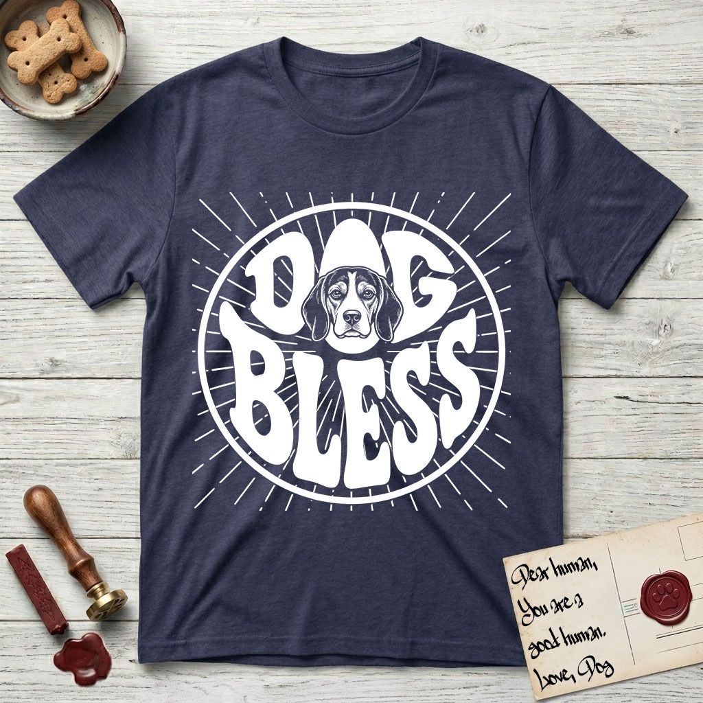Dog Bless Beagle T-Shirt flat lay in Navy, featuring Retro bubble-letter badge reading DOG BLESS with a gentle Beagle face framed in the letter O, hand-drawn sunburst rays radiating outward.