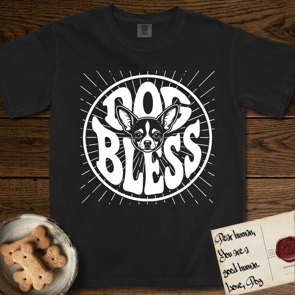 Dog Bless Chihuahua T-Shirt flat lay in Black, featuring Retro bubble-letter badge reading DOG BLESS with a wide-eyed Chihuahua face framed in the letter O, oversized ears reaching past the letter, hand-drawn sunburst rays radiating outward.