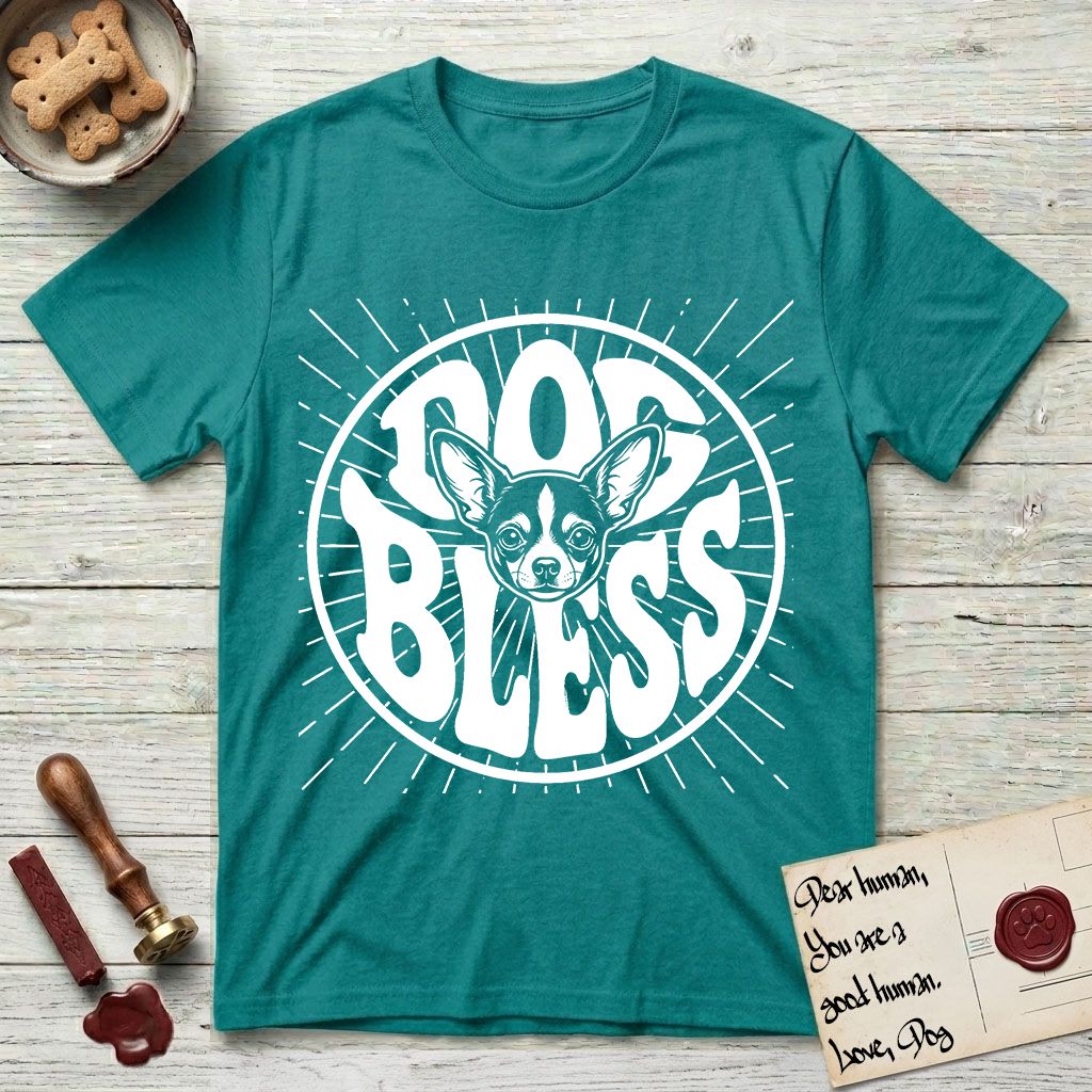 Dog Bless Chihuahua T-Shirt flat lay in Jade Dome, featuring Retro bubble-letter badge reading DOG BLESS with a wide-eyed Chihuahua face framed in the letter O, oversized ears reaching past the letter, hand-drawn sunburst rays radiating outward.