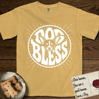Dog Bless Chihuahua T-Shirt flat lay in Mustard, featuring Retro bubble-letter badge reading DOG BLESS with a wide-eyed Chihuahua face framed in the letter O, oversized ears reaching past the letter, hand-drawn sunburst rays radiating outward.