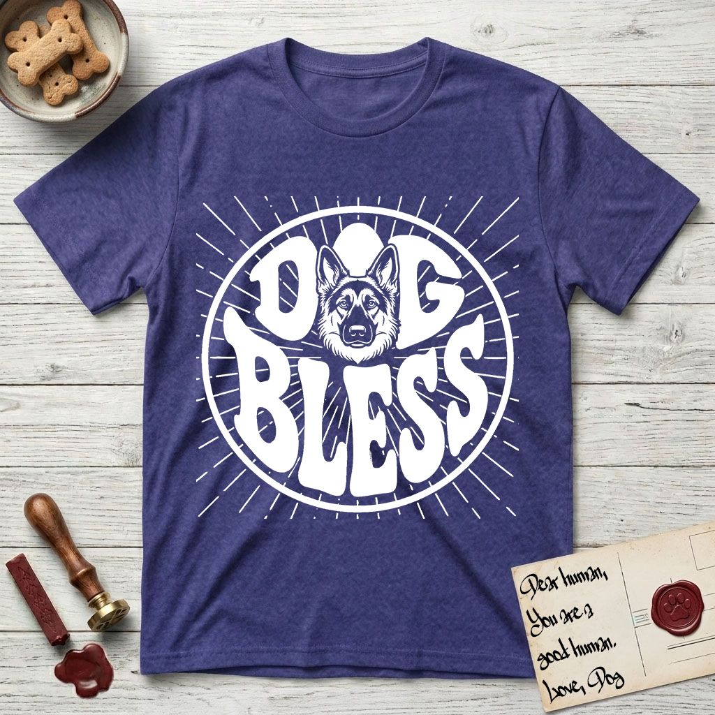 Dog Bless German Shepherd T-Shirt flat lay in Metro Blue, featuring Retro bubble-letter badge reading DOG BLESS with a German Shepherd face with tall upright ears framed in the letter O, hand-drawn sunburst rays radiating outward.