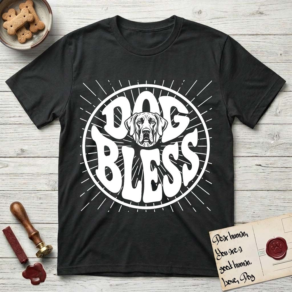 Dog Bless Great Dane T-Shirt flat lay in Black, featuring Retro bubble-letter badge reading DOG BLESS with a gentle Great Dane face with natural floppy ears framed in the letter O, hand-drawn sunburst rays radiating outward.