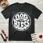 Dog Bless Great Dane T-Shirt flat lay in Black, featuring Retro bubble-letter badge reading DOG BLESS with a gentle Great Dane face with natural floppy ears framed in the letter O, hand-drawn sunburst rays radiating outward.