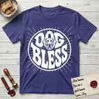Dog Bless Great Dane T-Shirt flat lay in Metro Blue, featuring Retro bubble-letter badge reading DOG BLESS with a gentle Great Dane face with natural floppy ears framed in the letter O, hand-drawn sunburst rays radiating outward.