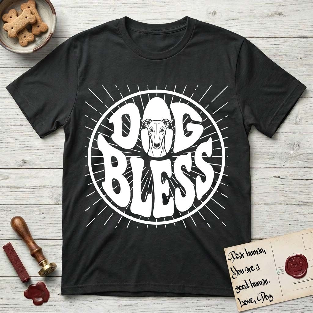Dog Bless Greyhound T-Shirt flat lay in Black, featuring Retro bubble-letter badge reading DOG BLESS with a slender Greyhound face with folded rose ears framed in the letter O, hand-drawn sunburst rays radiating outward.