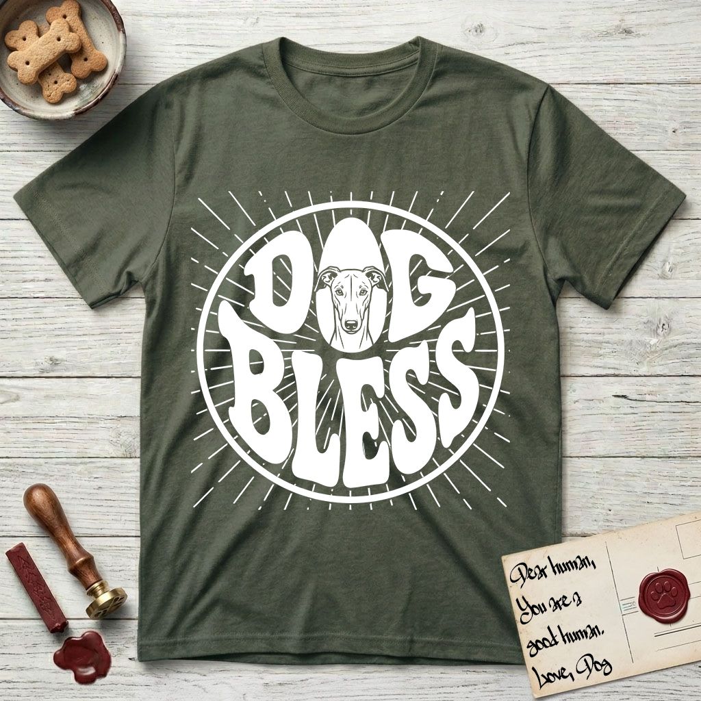 Dog Bless Greyhound T-Shirt flat lay in Heather Military Green, featuring Retro bubble-letter badge reading DOG BLESS with a slender Greyhound face with folded rose ears framed in the letter O, hand-drawn sunburst rays radiating outward.