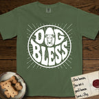 Dog Bless Greyhound T-Shirt flat lay in Moss, featuring Retro bubble-letter badge reading DOG BLESS with a slender Greyhound face with folded rose ears framed in the letter O, hand-drawn sunburst rays radiating outward.