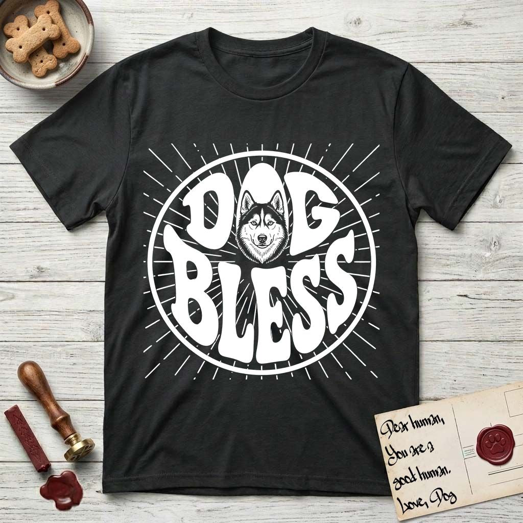 Dog Bless Husky T-Shirt flat lay in Black, featuring Retro bubble-letter badge reading DOG BLESS with a masked Husky face framed in the letter O, hand-drawn sunburst rays radiating outward.