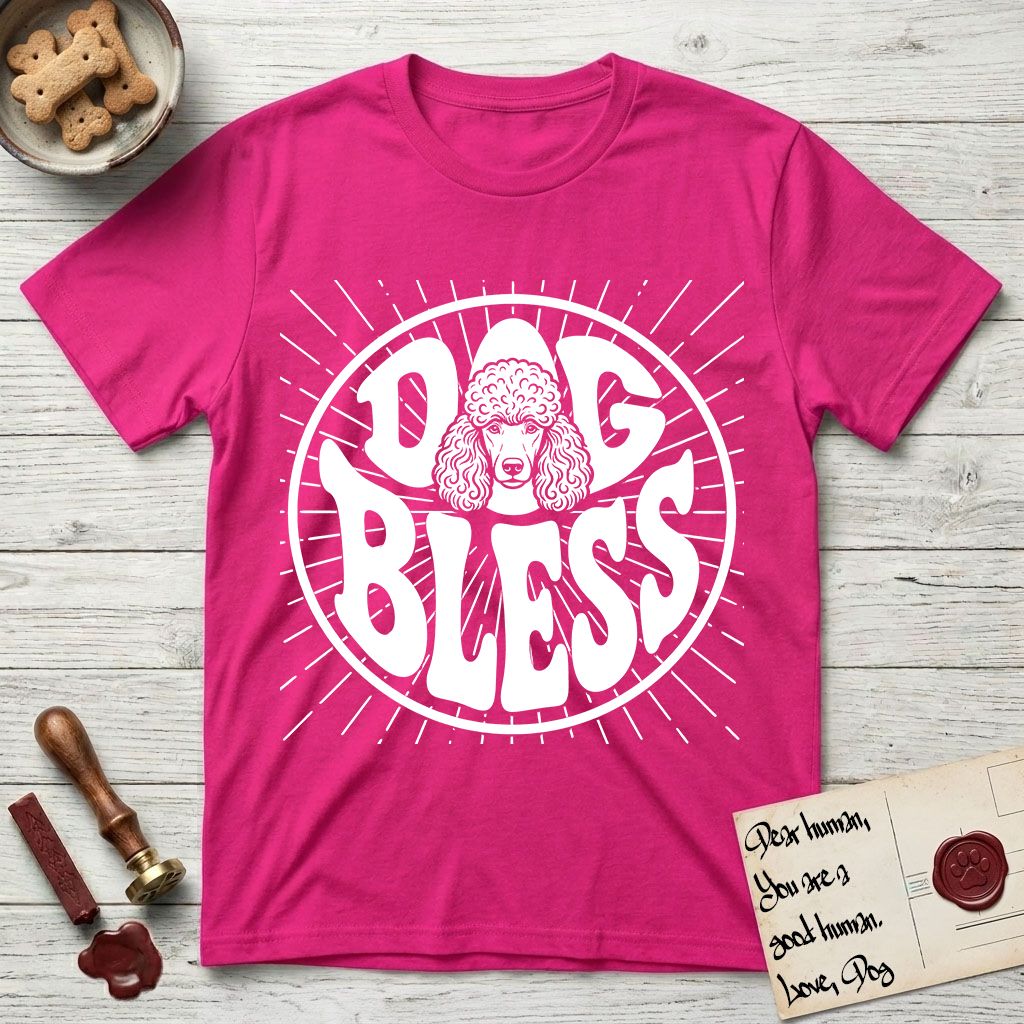 Dog Bless Poodle T-Shirt flat lay in Heliconia, featuring Retro bubble-letter badge reading DOG BLESS with a Poodle face with curly topknot and long curled ears framed in the letter O, hand-drawn sunburst rays radiating outward.