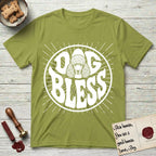 Dog Bless Poodle T-Shirt flat lay in Kiwi, featuring Retro bubble-letter badge reading DOG BLESS with a Poodle face with curly topknot and long curled ears framed in the letter O, hand-drawn sunburst rays radiating outward.