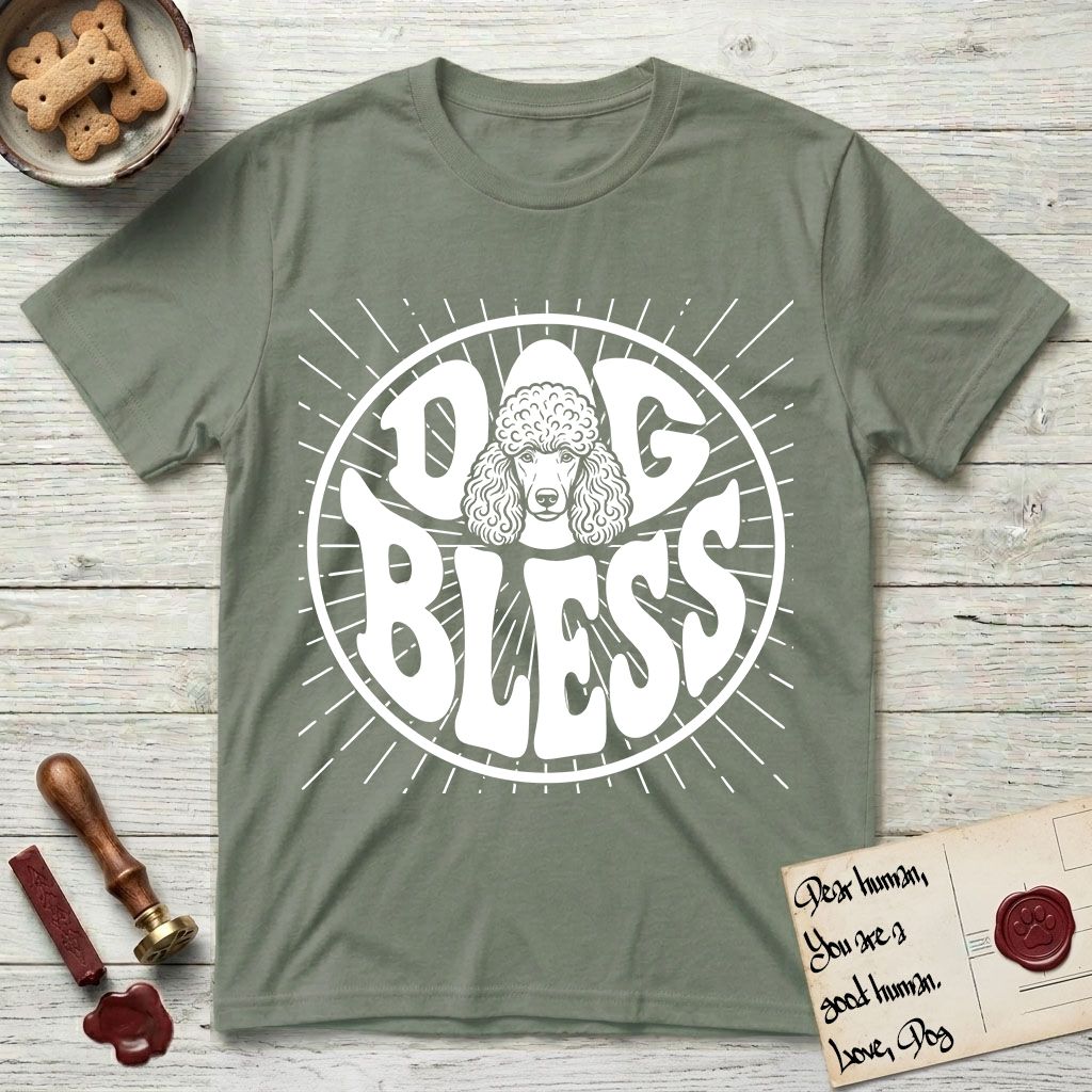 Dog Bless Poodle T-Shirt flat lay in Sage, featuring Retro bubble-letter badge reading DOG BLESS with a Poodle face with curly topknot and long curled ears framed in the letter O, hand-drawn sunburst rays radiating outward.