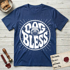 Dog Bless Pug T-Shirt flat lay in Royal, featuring Retro bubble-letter badge reading DOG BLESS with a wrinkled Pug face with large round eyes framed in the letter O, hand-drawn sunburst rays radiating outward.