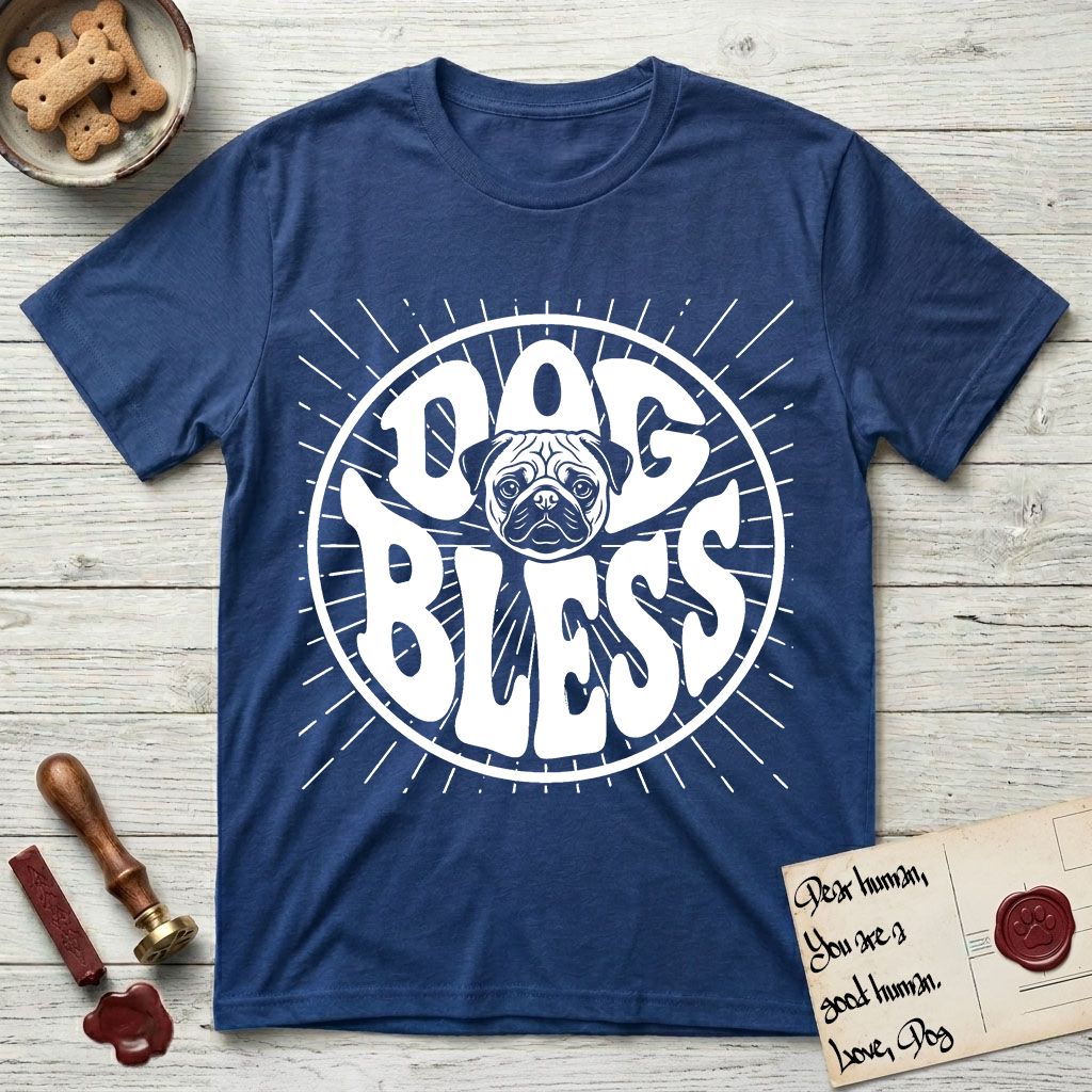 Dog Bless Pug T-Shirt flat lay in Royal, featuring Retro bubble-letter badge reading DOG BLESS with a wrinkled Pug face with large round eyes framed in the letter O, hand-drawn sunburst rays radiating outward.