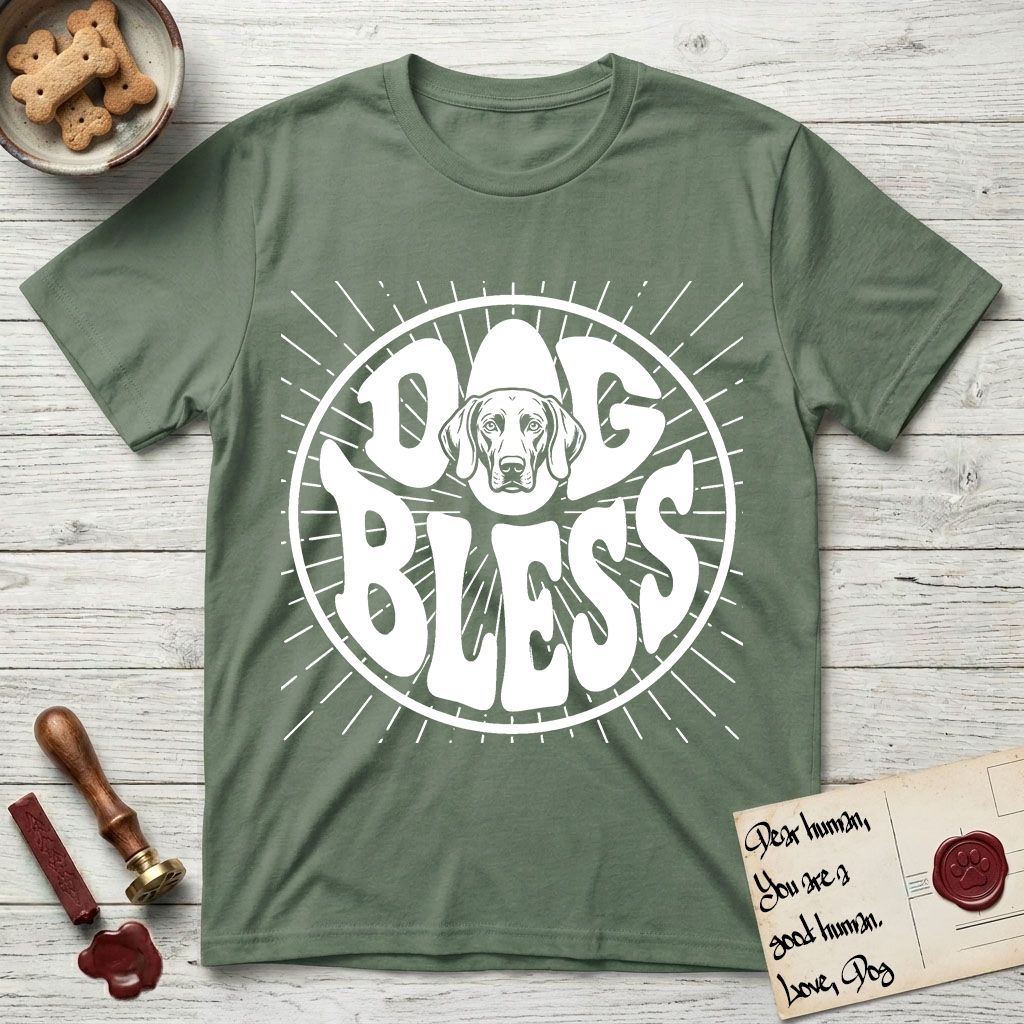 Dog Bless Weimaraner T-Shirt flat lay in Military Green, featuring Retro bubble-letter badge reading DOG BLESS with a sleek Weimaraner face with long velvet ears framed in the letter O, hand-drawn sunburst rays radiating outward.